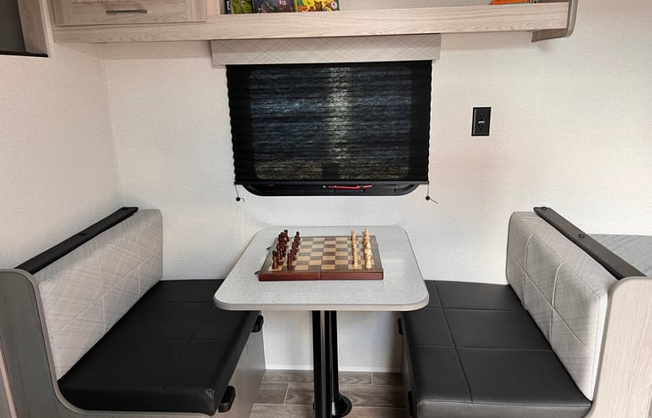 Dinette set also folds down to serve as another bed.