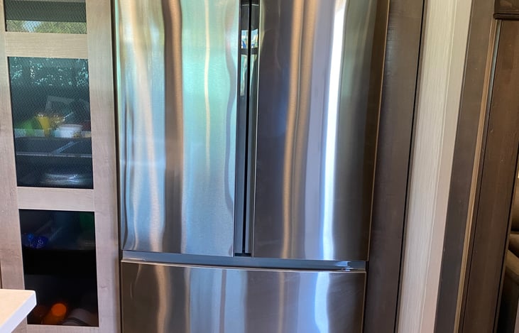 Residential size fridge with freezer drawer