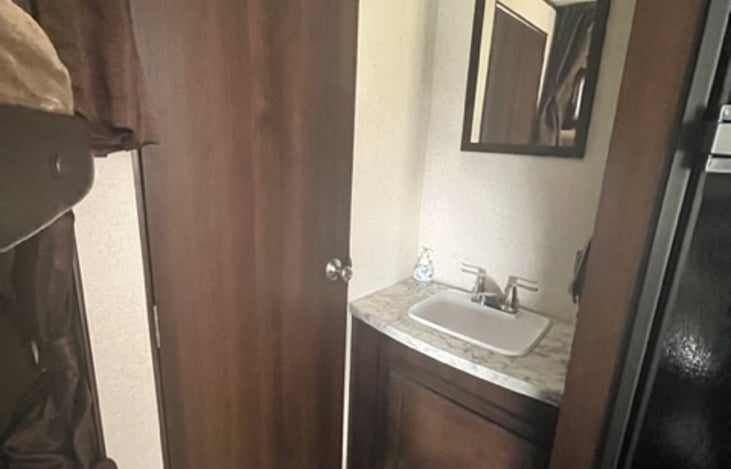 Bathroom vanity and bathroom entrance