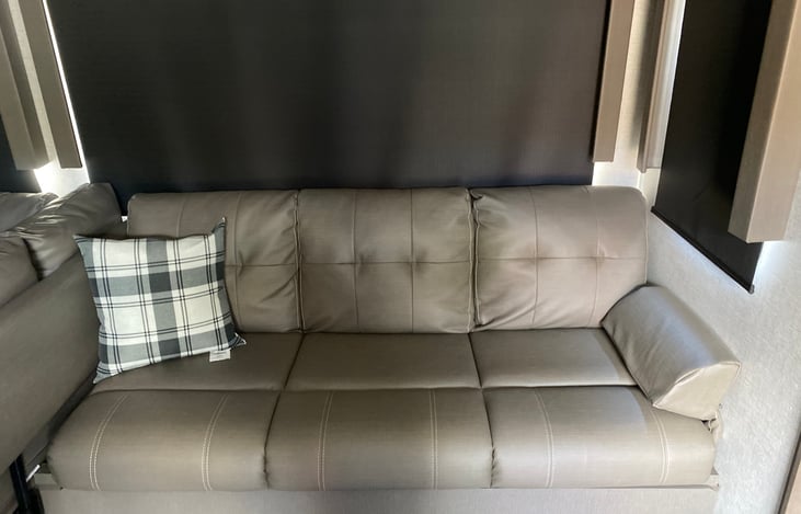 Main seating area as well as this couch does convert into a bed