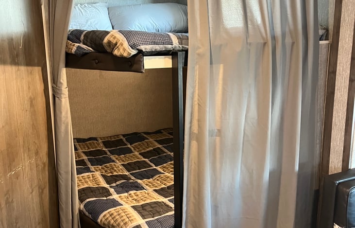 Privacy curtains on bunk beds.