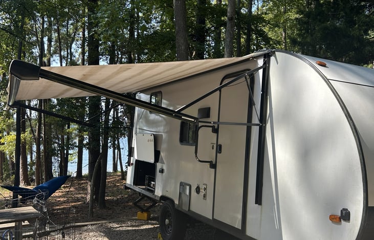 Entrance and outdoor kitchen with awning