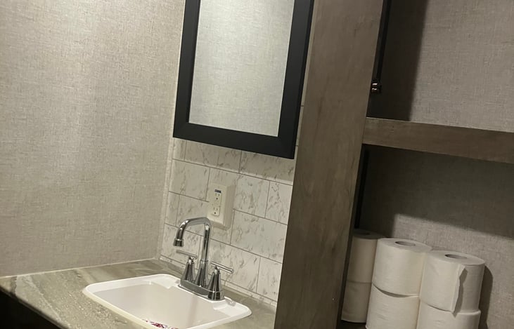 Bathroom sink, over the toilet storage