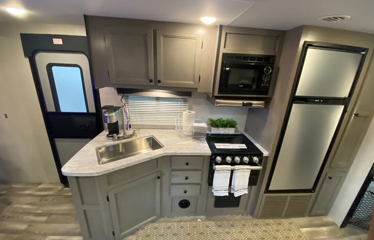 All kitchen appliances for all your cooking needs. Pots, plates, bowls, cutting boards, soap all included.