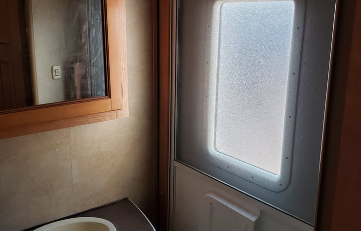 The back entry door that leads through the half bath, then to the bunkroom.