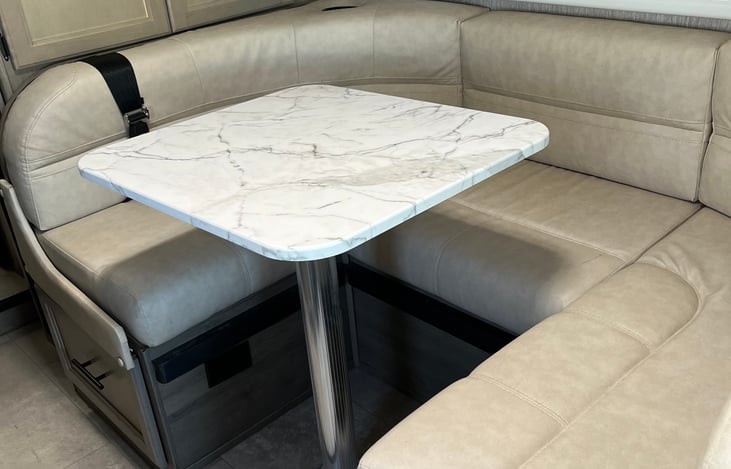 Dining area converts into a twin bed or sofa.