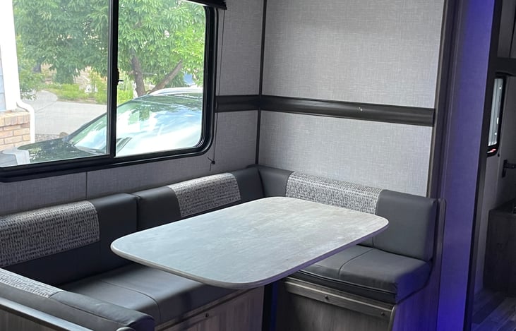 Dining table that converts into a bed  - also has storage underneath cushions.