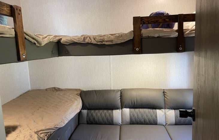 Three bunks plus the couch folds down for an additional bed