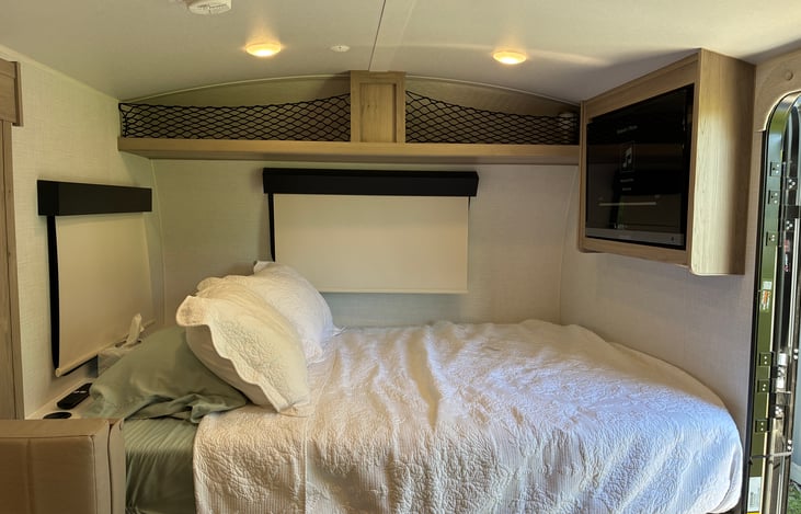 Queen size bed with TV