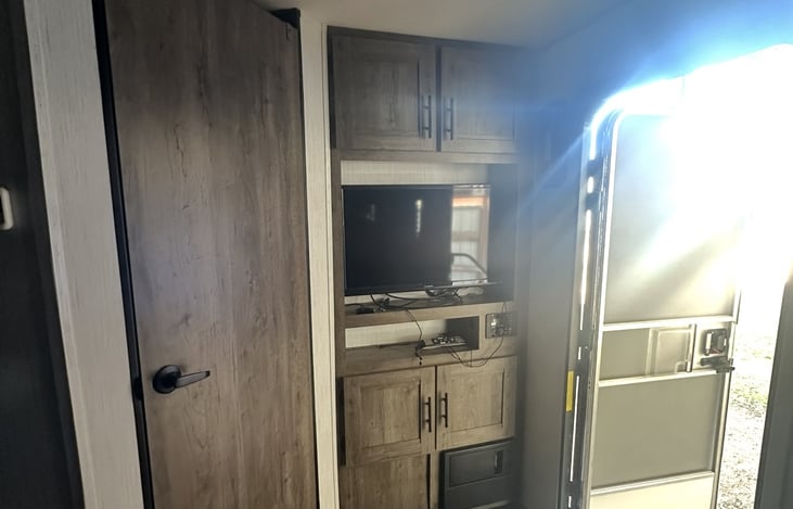 32" TV - includes cabinet of DVD's and ROKU