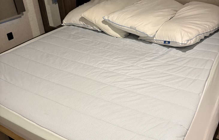 Cooling mattress cover and pillow top in master bedroom.