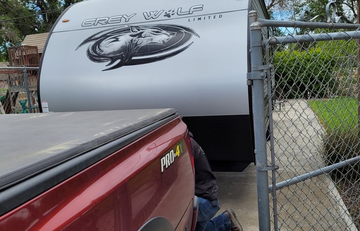 Parking the RV in the back gated area, where a stationary rental would have access to full power, filtered water, propane and access to a lighted covered patio, barbeque and gas fire pit.