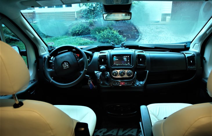 View of the driving area. Both chairs to turn around to face the living quarters.
