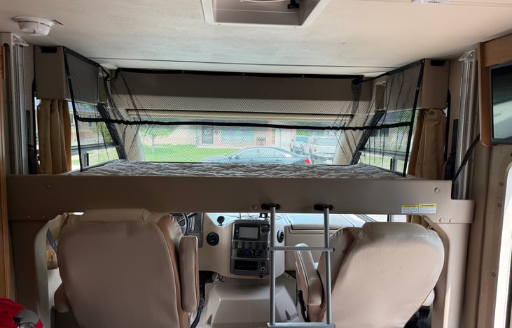 Loft bed fully lowered. Removable ladder makes getting up & down from loft easy!