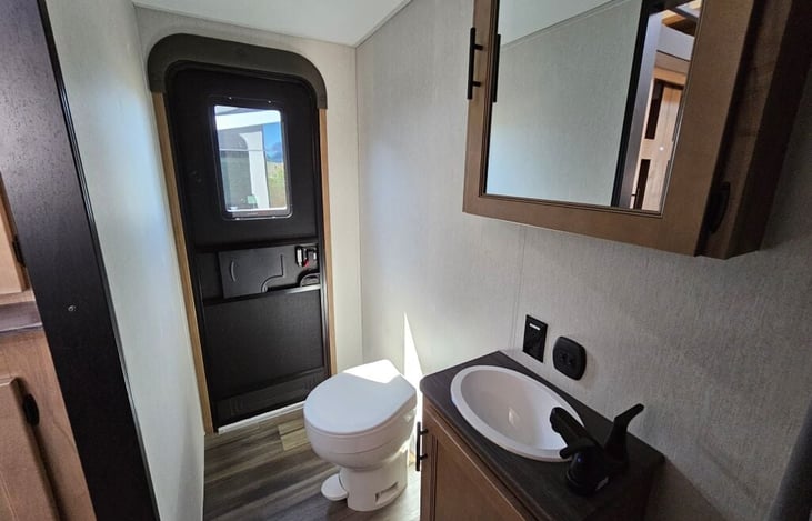 Bath 2. Includes tub/shower combo, sink with storage and toilet. This area also has an alternate entry from the exterior