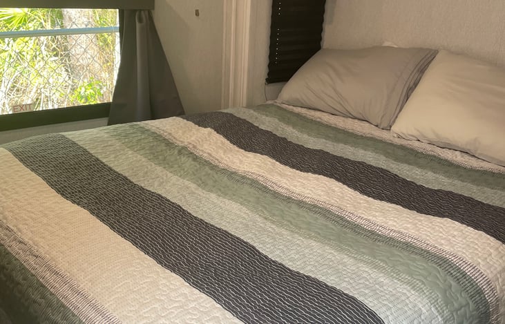 Queen size bed in the private bedroom with upgraded mattress from Brooklyn Bedding. This is the most comfortable mattress we have ever slept on.
