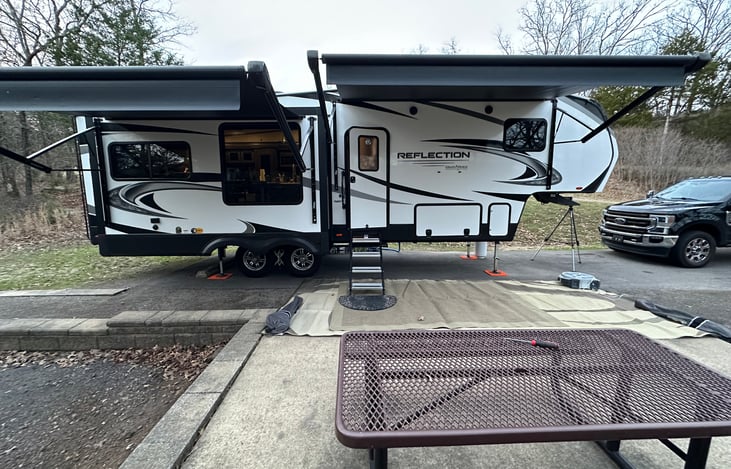 This provides a side view. The bedroom and bathroom with full walk-in shower is in the upper section to the right of the entrance door. Bedroom with slide out and Queen size bed.