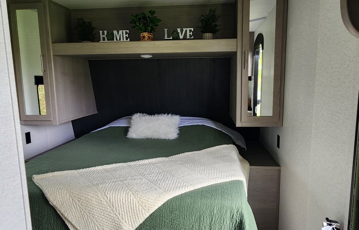 Queen bed. Storage under. Privacy curtain.