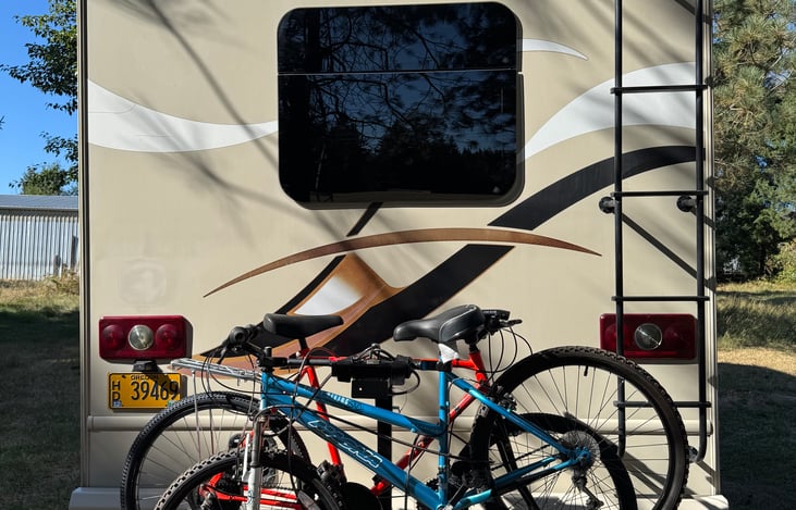 Bike rack that holds 4 bikes with 2 of the available 4 bikes for guest use.
