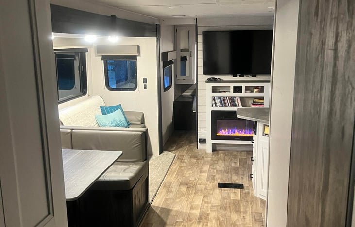 Large pantry to the left and bathroom is on the right. Table folds to bed as well as well as the couch. Full size fridge and microwave