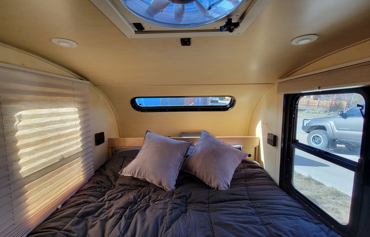 Where you sleep.
This area is where you sleep. There is a cup holder for your nightcap and storage behind you and above you on the wall.