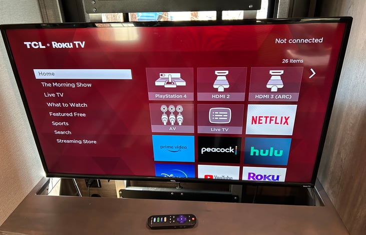 Smart Roku TV in living Room with "televator" so the TV can be hidden at will behind the fireplace if you are seeking an electronics free getaway!