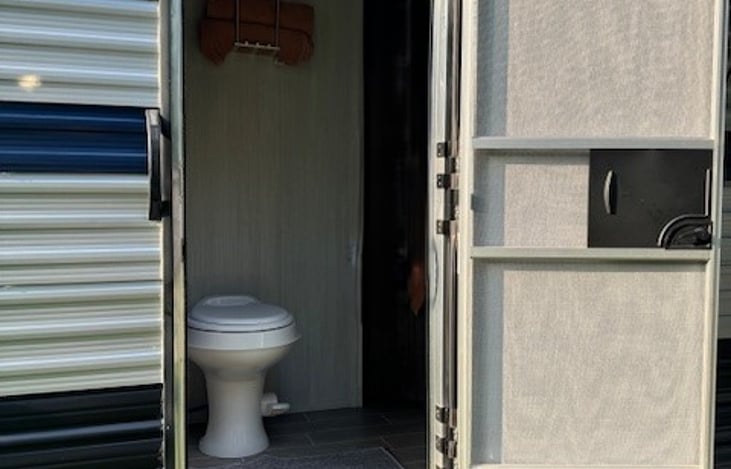 The camper has two entrances; this one goes directly into the bathroom - less tracking in the camper :)