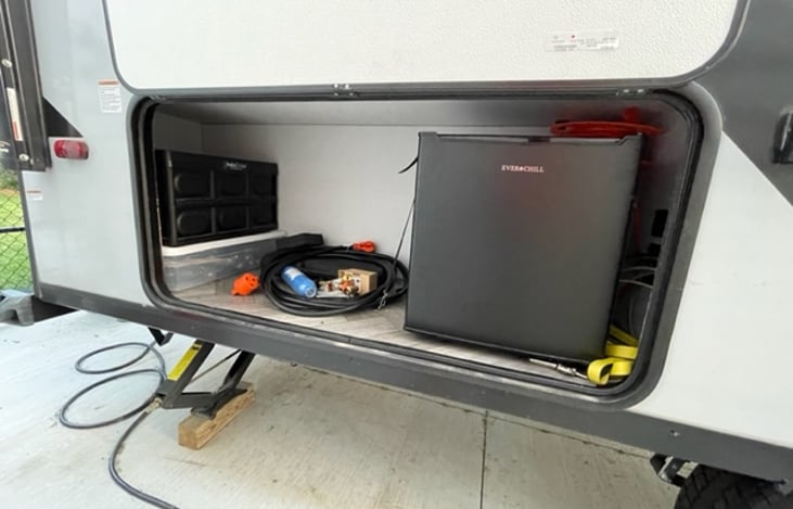 Right rear storage. Better pictures to come. purchased new clear storage totes for easier setup and site tear down.