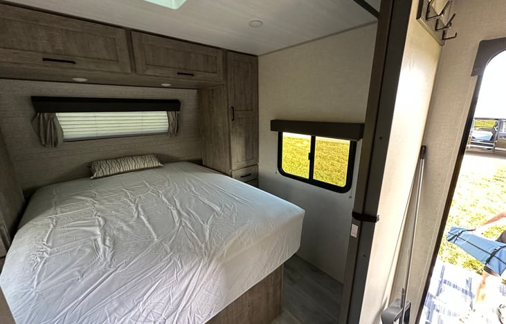 Queen sized Mattress - Cubbies with Charging outlets on both sides behind cabinets (storage for phones, wallets,drinks, etc. while sleeping)

Storage compartment under mattress