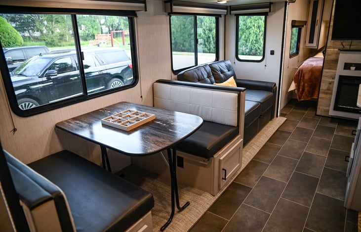 Plenty of seating options for meals, games, or just hanging out! The spacious dinette and comfy couch make this the perfect spot for gathering together.