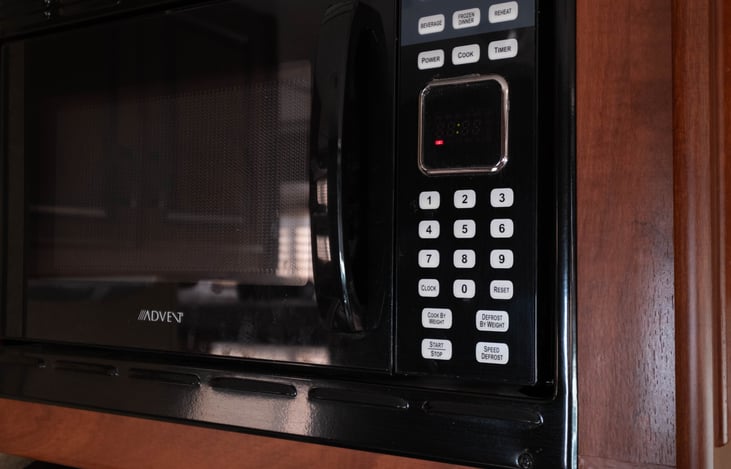 Microwave (can be used while driving with the generator on) for quick snacks while driving or setting up.