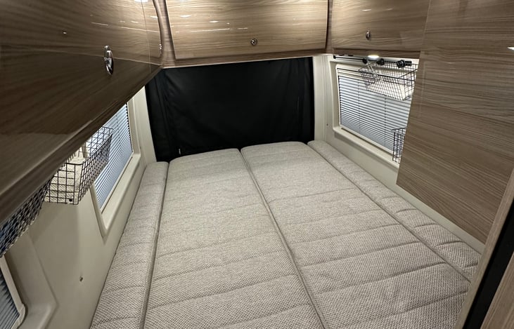 Bed made down. Queen size.