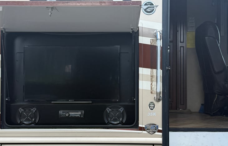 Outside entertainment system includes smart flat screen TV, DVD player, radio, and speakers!
