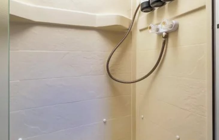 Clean, roomy RV shower — ideal for long trips or festival stays where comfort matters.