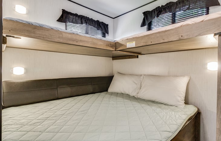 Queen size bottom bed that folds out or turns into a couch area if needed.