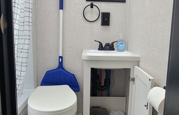 Bathroom with open cabinet