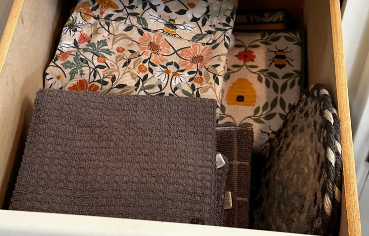 I’ve got you covered with dish towels, potholders, hot plate trivets, and even an apron.