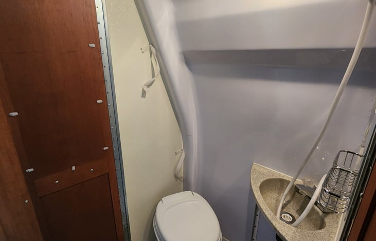 Shower, sink,  and toilet convinced into one.