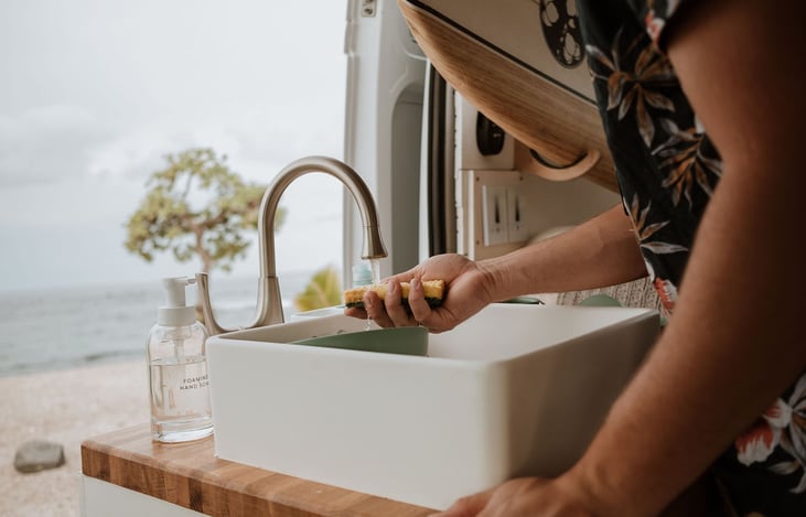 The sink has a manual foot pump to help conserve water and six gallons for each clean and grey water.