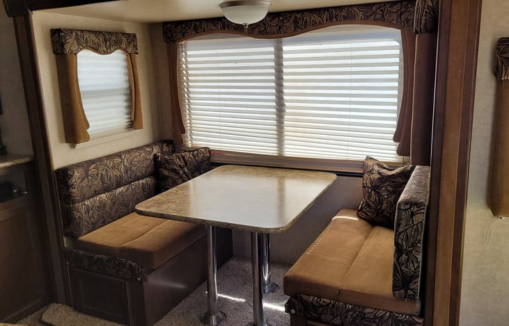 Dinette Area:  Table breaks down into a full-size bed