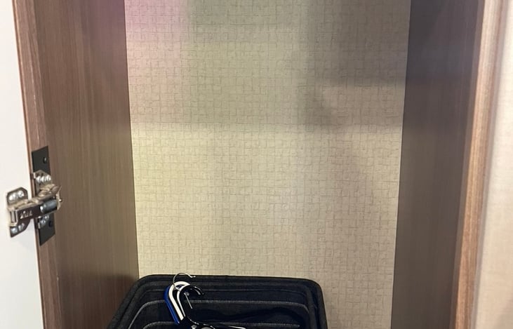 Photo doesn't show space well but this is the closet with a rod. Included are 3 bins for storage for the overhead compartments if wanted and a handful of hangars.