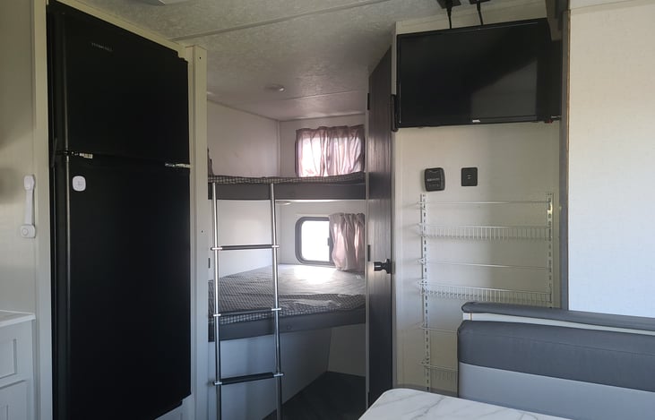 Double sized bunks with ceiling lights and USB ports