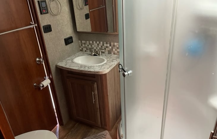 Bathroom with stand up shower.
