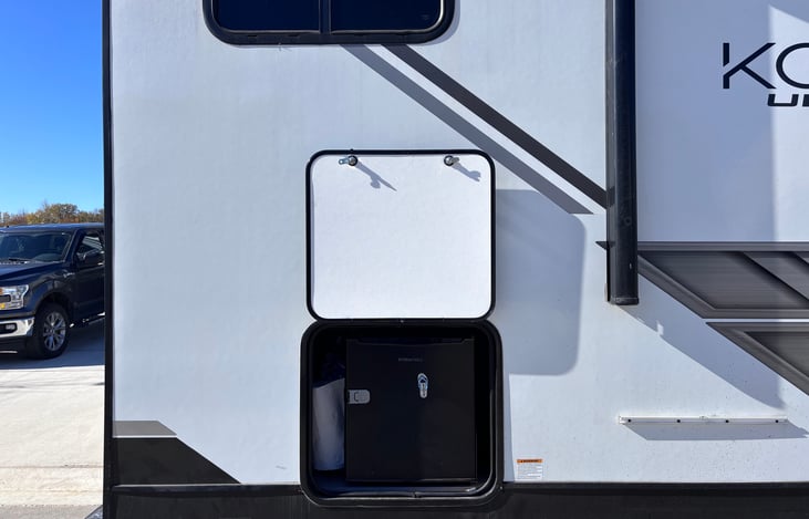Mini Fridge, with gas griddle bracket to the right. (Gas line located under bracket and installs directly underneath for griddle use.)
