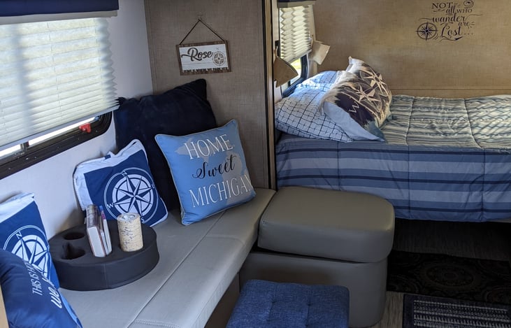 The Dinette area can be converted to a 48" x 72" bed. Dining table available if requested.