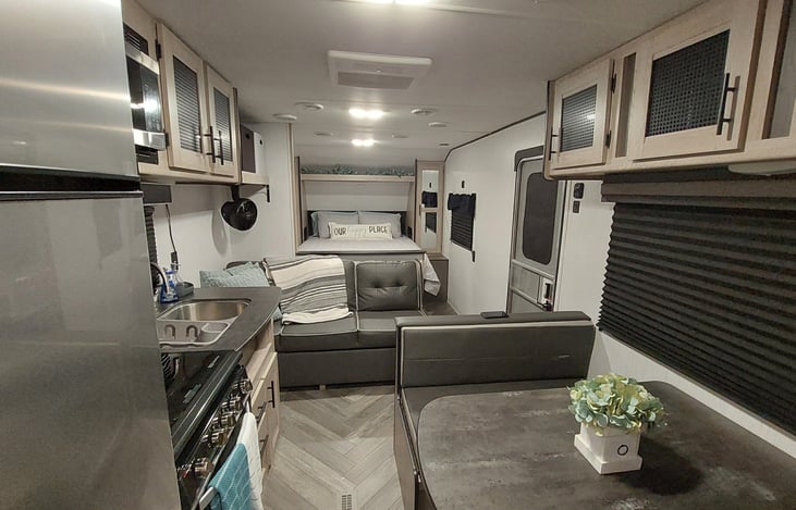 Both dinning table and sofa become beds for extra sleeping space.