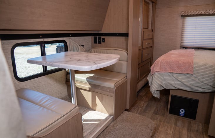 Bottom bunk converts to a two seater dinette perfect to keep our younger campers entertained.  iPad holders and charging stations are mounted on the wall to provide endless entertainment (BYO iPad)