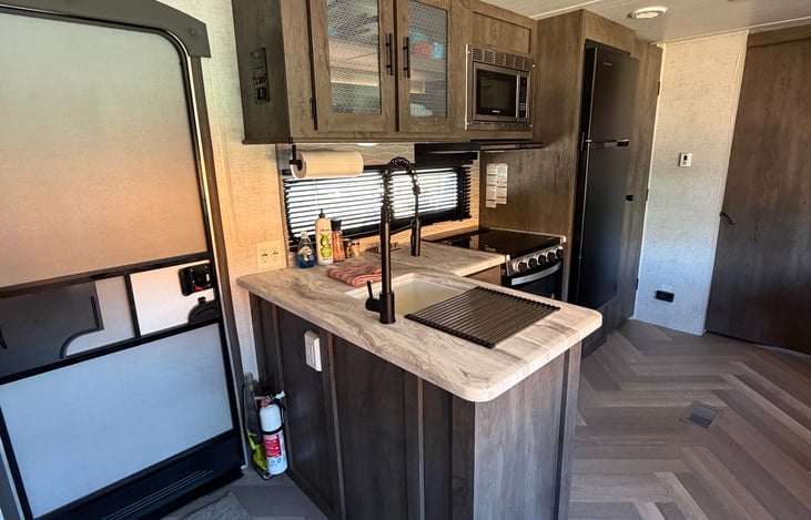 Lots of counter space on the L-shaped kitchen.