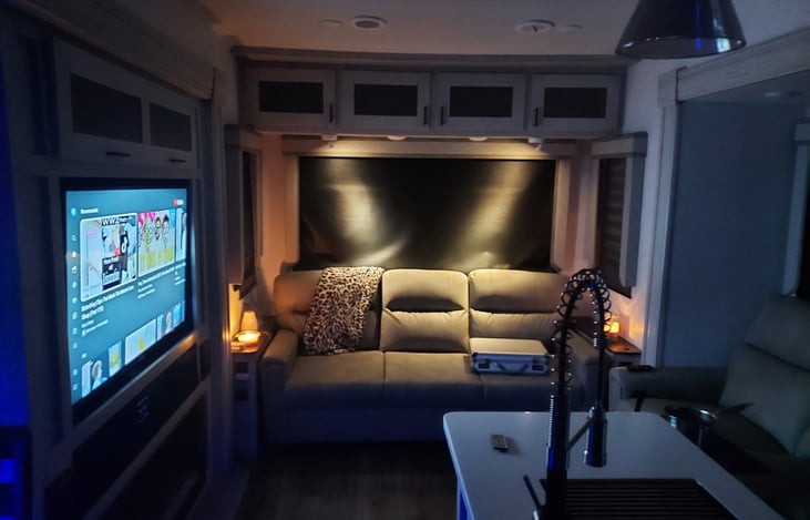 Living room from kitchen with low level lighting