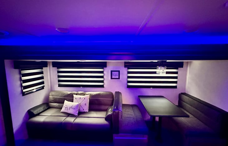 Living room has additional jack knife sofa (full size)and  dining table area converts to additional sleeping area for extra guests.